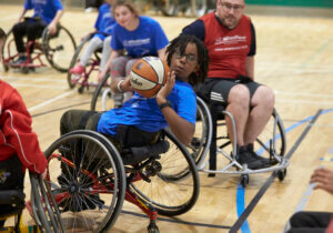 Teenager playing wheelchair basketball at WheelPower National Junior Games 2019