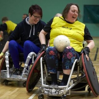 Women's wheelchair rugby game in action