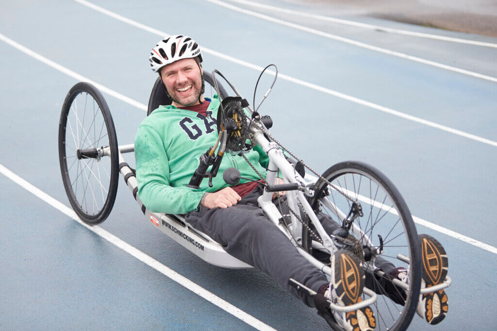 Hand cyclist cycling at Stoke Mandeville Stadium