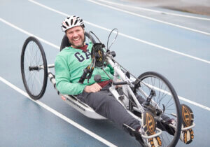 Hand cyclist cycling at Stoke Mandeville Stadium