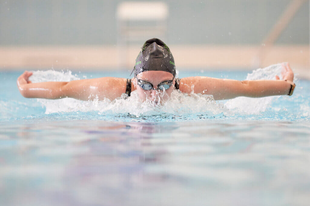 Swimmer in action doing breaststroke