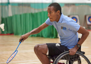 Wheelchair badminton player in action