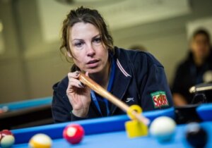 Close up of a pool player in action
