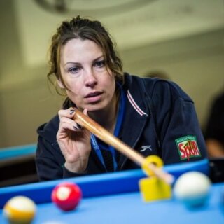 Close up of a pool player in action