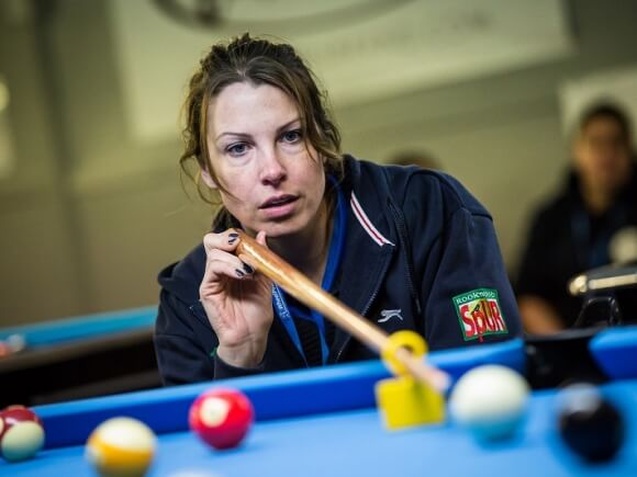 Close up of a pool player in action