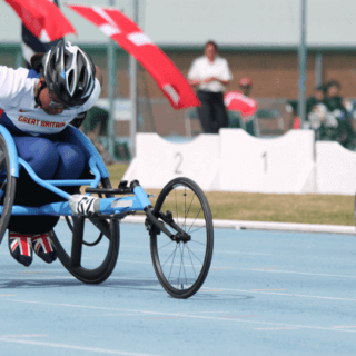 Wheelchair racer on the track during a 100m competition