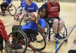 Young wheelchair basketball player dring a match