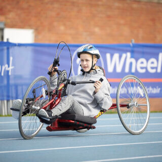 Hand cyclist in action