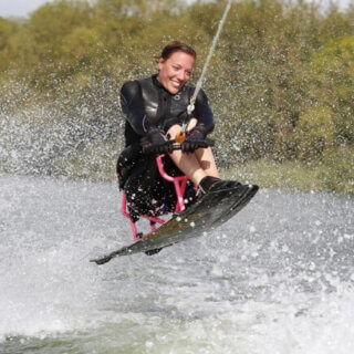 seated wakeboarder in action