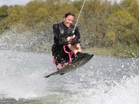 seated wakeboarder in action