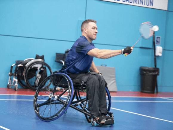 Wheelchair badminton player in action