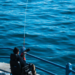 Wheelchair user fishing