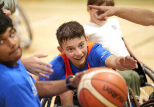 smiling young wheelchair basketball player