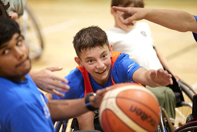 smiling young wheelchair basketball player
