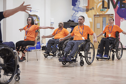 wheelchair exercise class orange tshirts