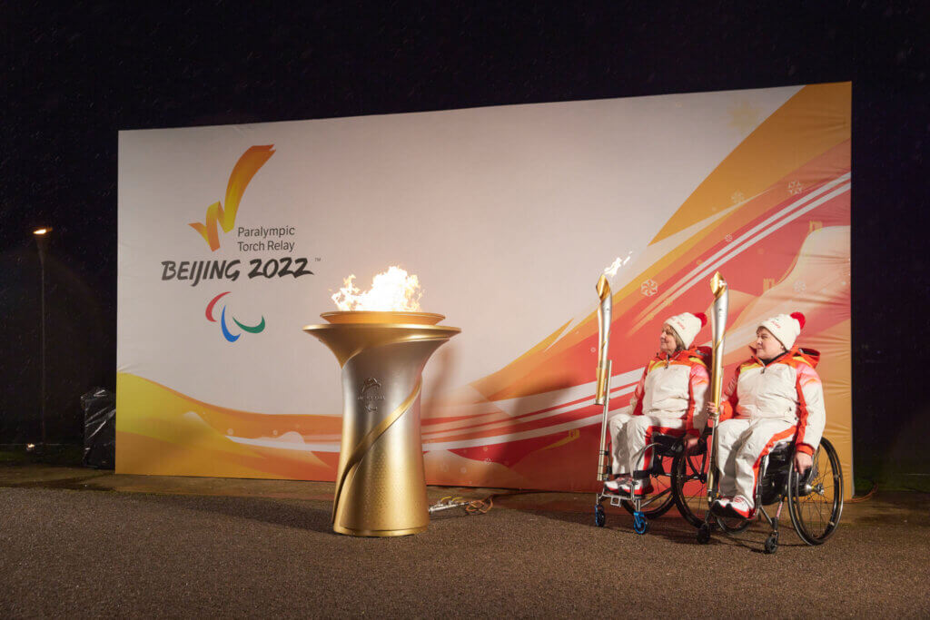 Lighting the torch for the Beijing Paralympic Torch Relay