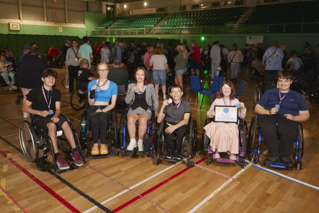 Beth at her team mates collecting awards