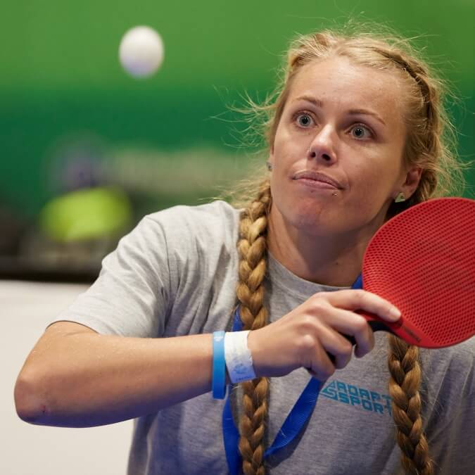 Casey close up playing table tennis