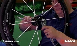 adjusting axel pins close up wheelchair maintenance film thumbnail