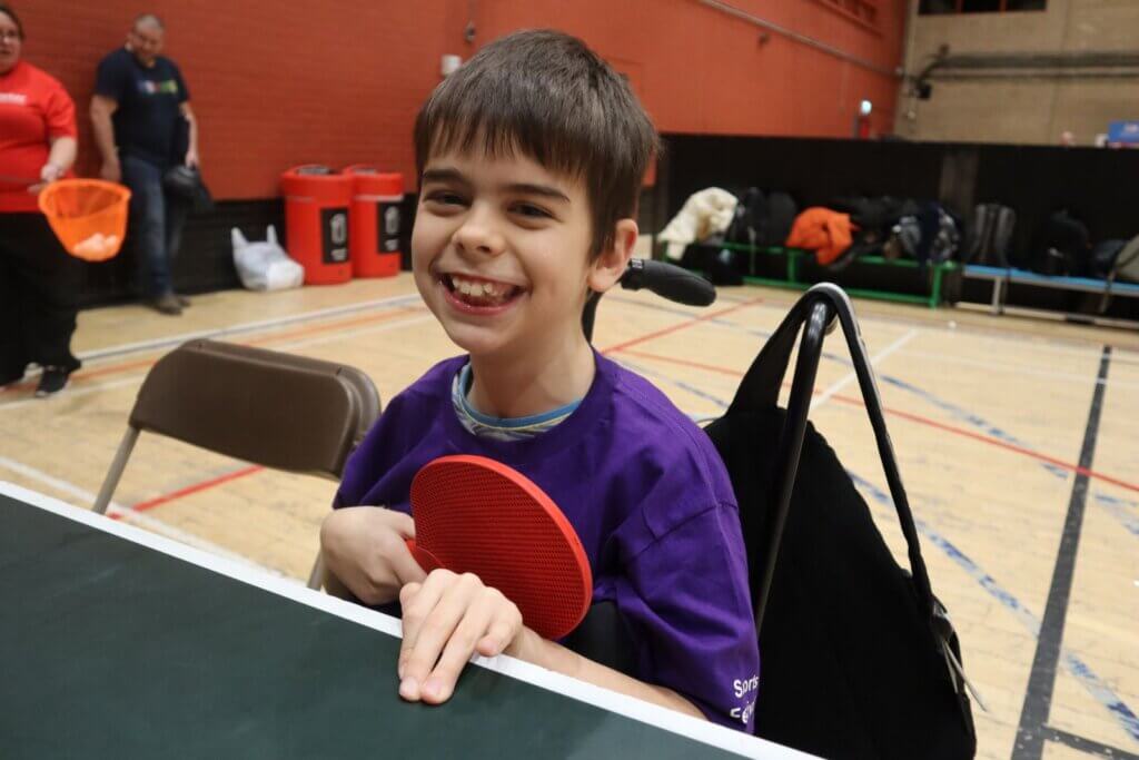 Happy boy with table tennis bat
