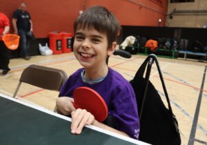 Happy boy with table tennis bat