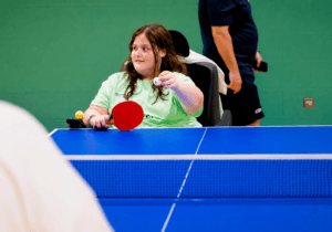 Maisie taking part in table tennis at the WheelPower National Junior Sports Festival